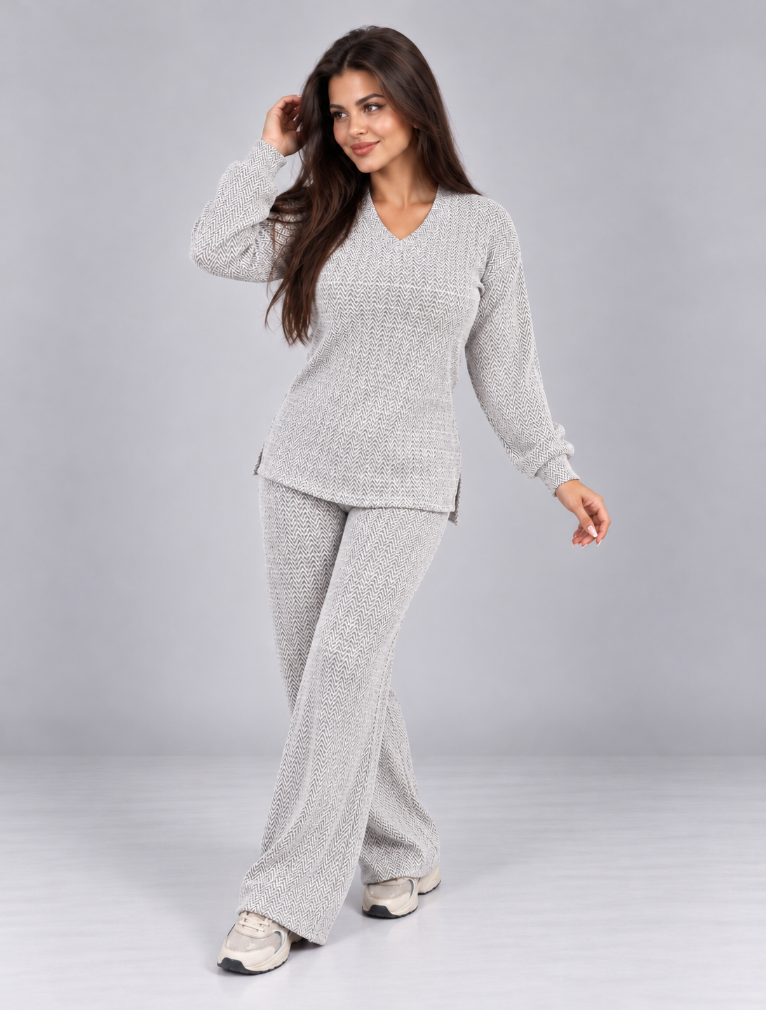Two-piece set featuring a long-sleeve, V-neck blouse and matching pants