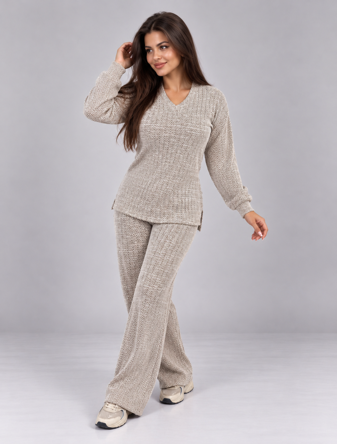 Two-piece set featuring a long-sleeve, V-neck blouse and matching pants