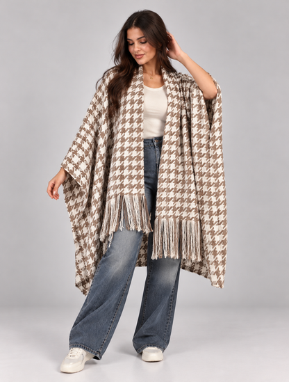 A wide poncho featuring an elegant open front design