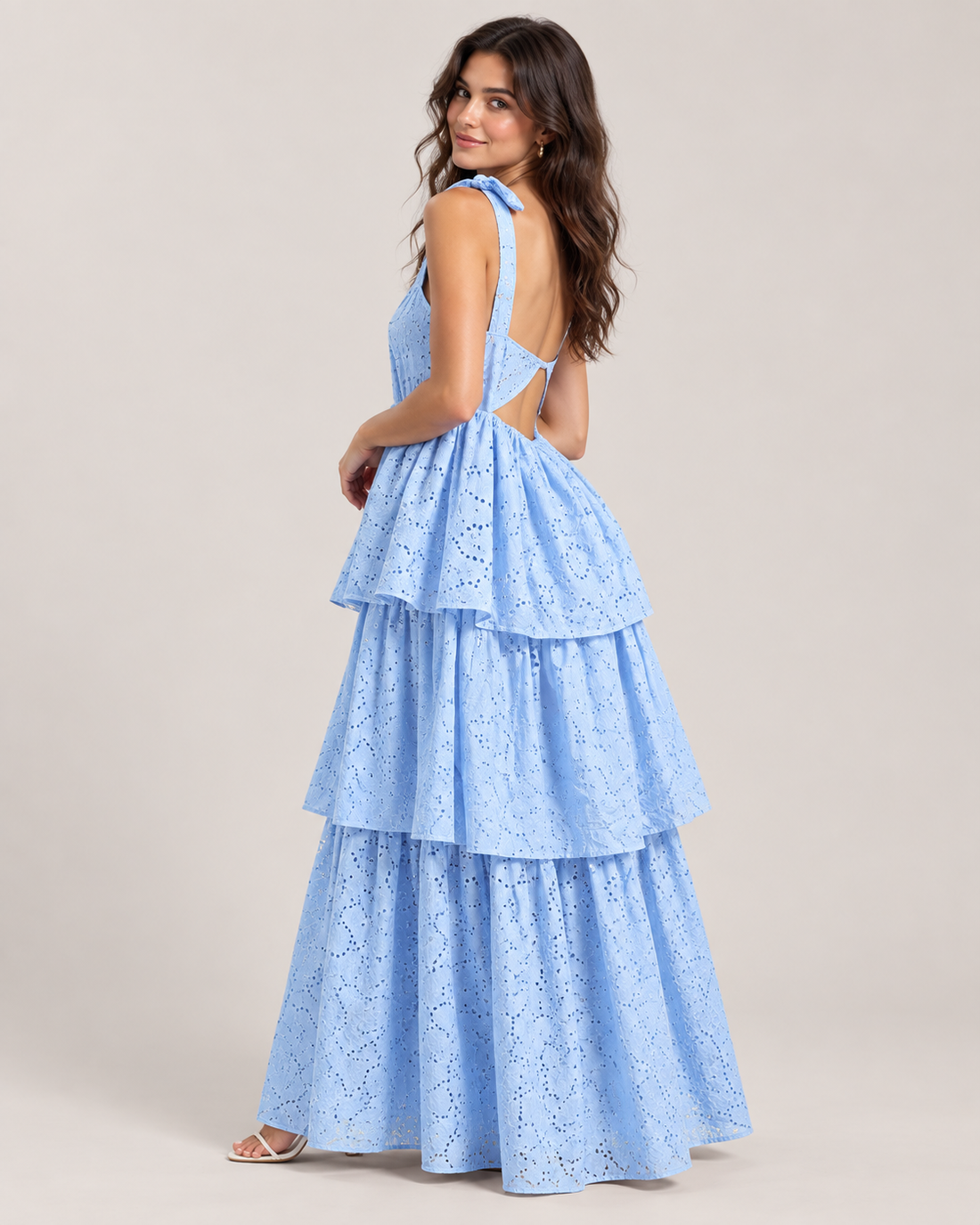 Missan backless long ruffle dress in Blue on unified greige studio background